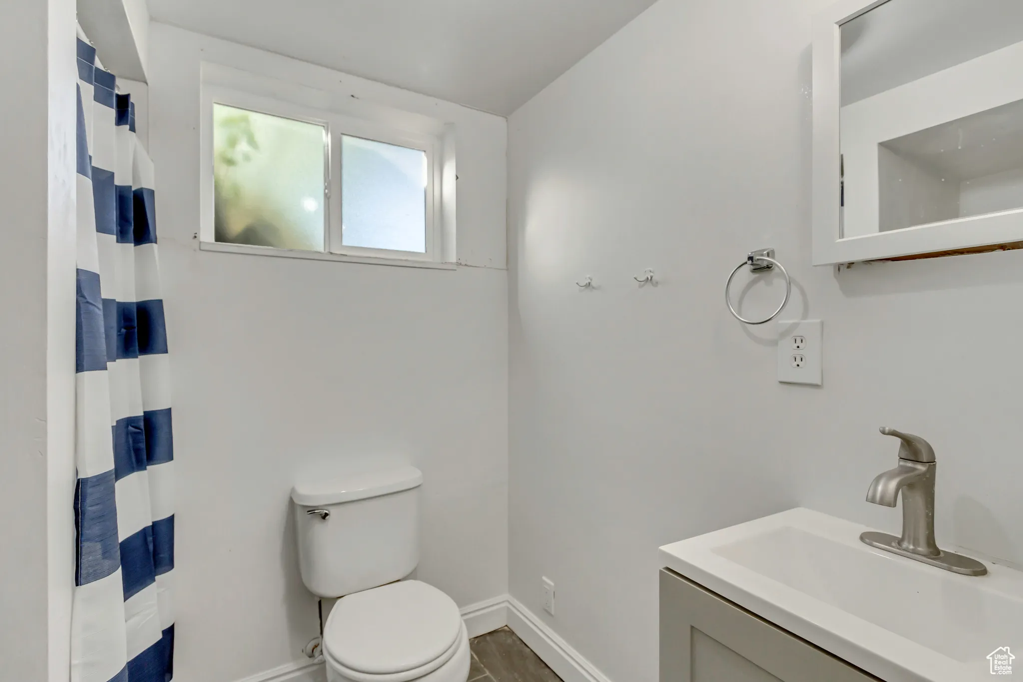 Bathroom featuring vanity and a shower with shower curtain