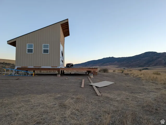 View of side of home featuring a mountain view