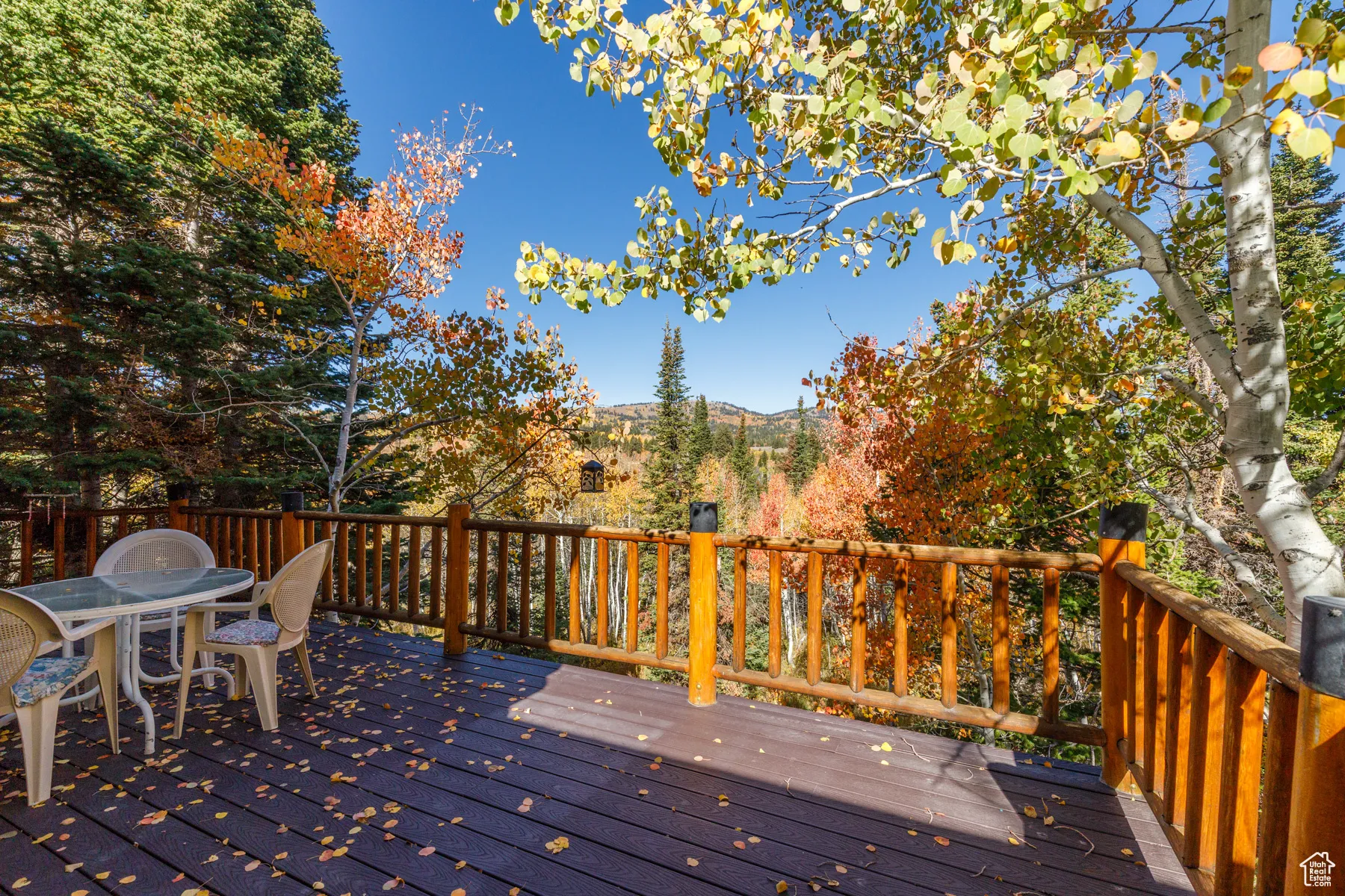Deck featuring outdoor dining area and a mountain view