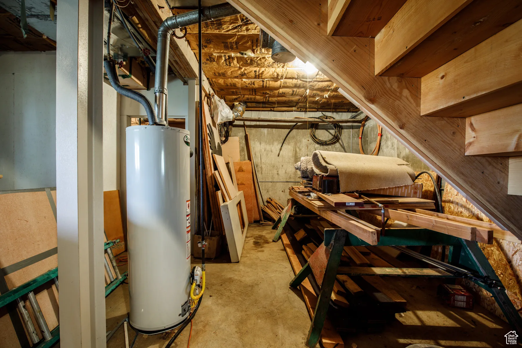 Unfinished basement with gas water heater