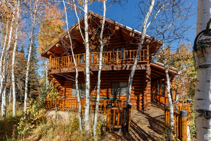 Back of house featuring log exterior