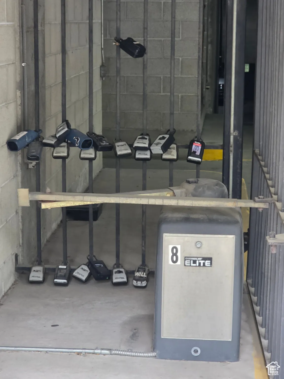 Keybox location near secured parking garage gate