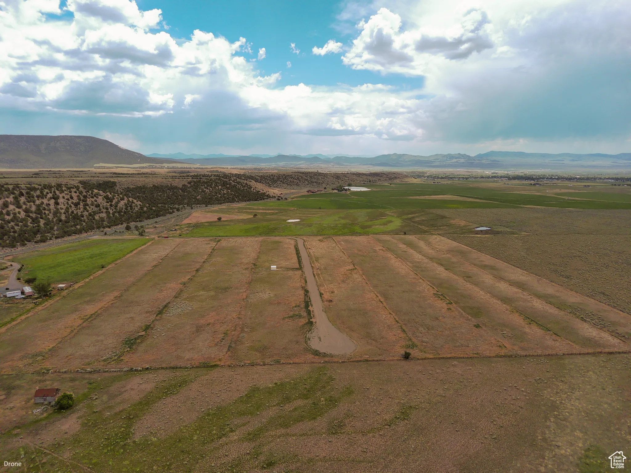 Overview of rural landscape with a mountain backdrop