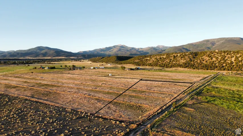View of mountain backdrop with rural landscape