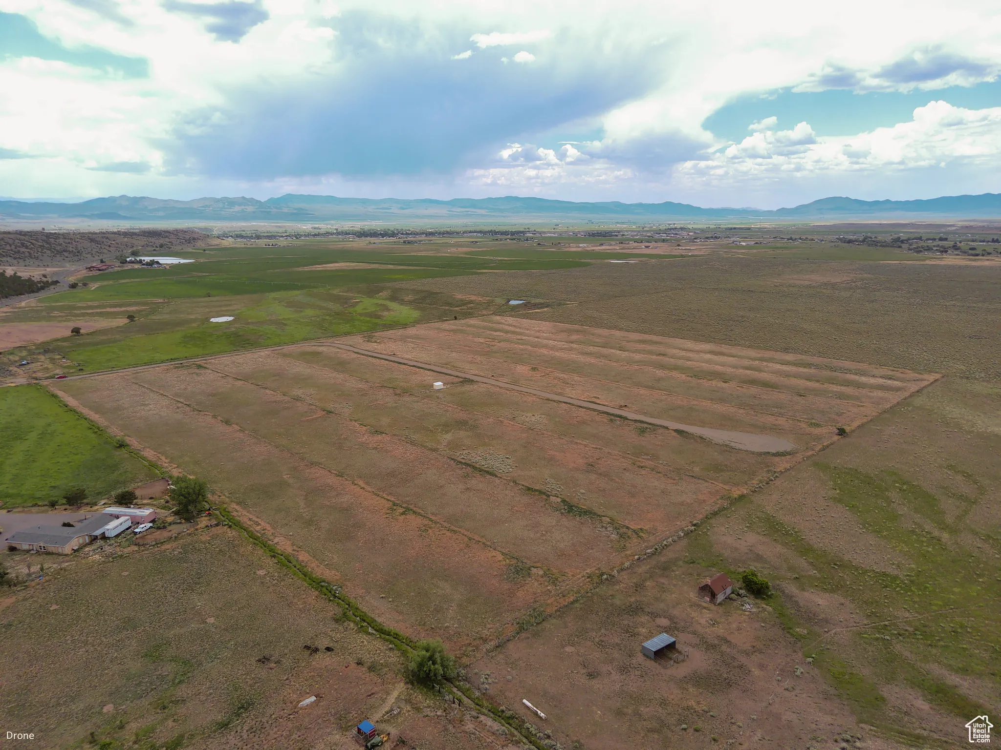 Overview of rural landscape with a mountain backdrop