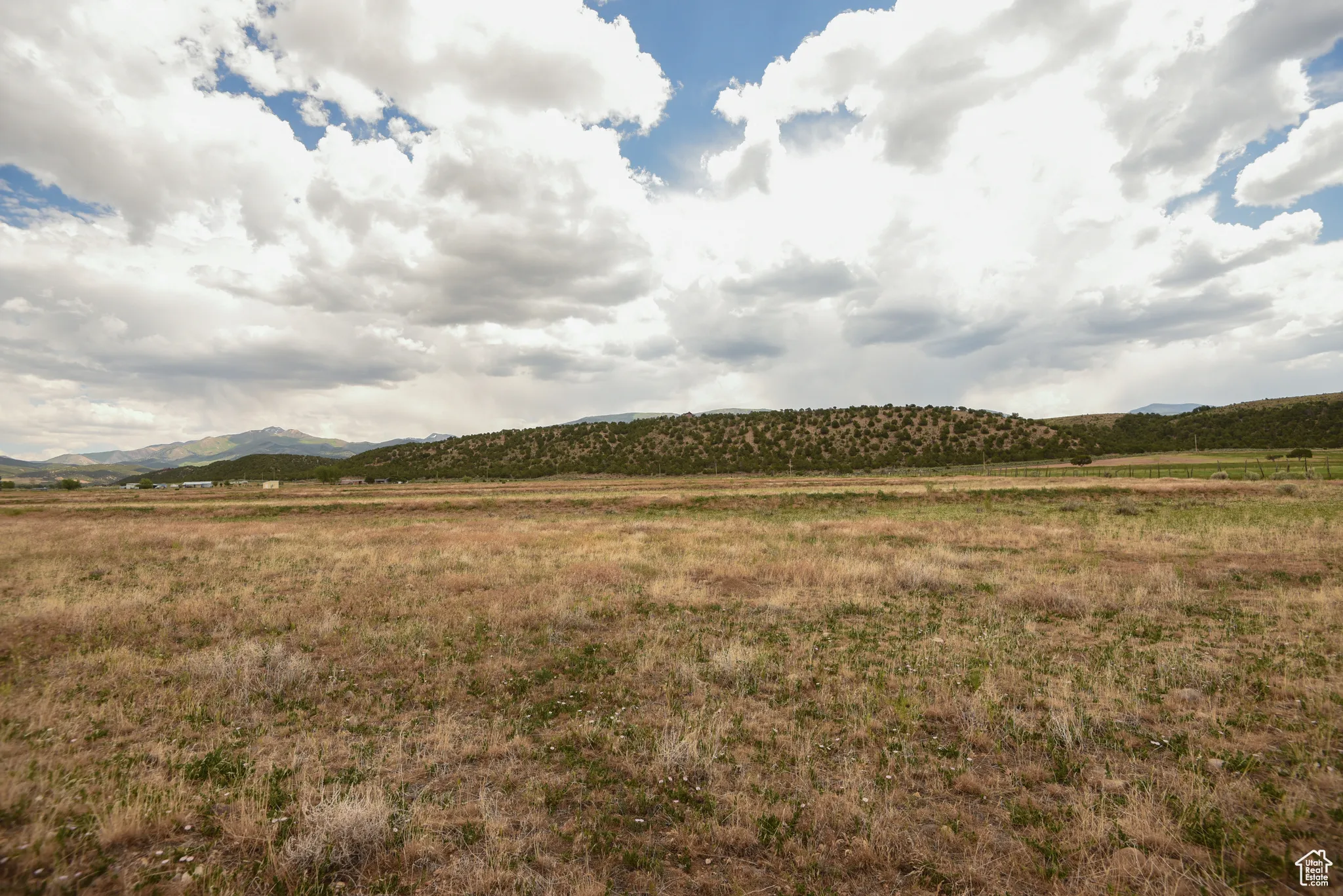View of mountain background featuring rural landscape