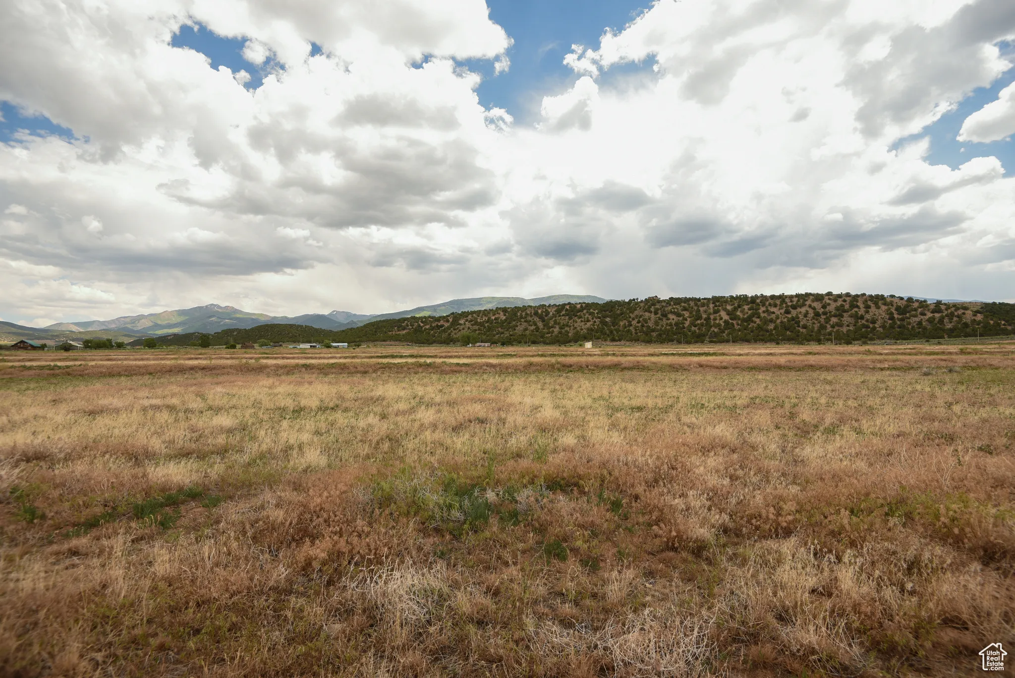View of mountain backdrop featuring rural landscape