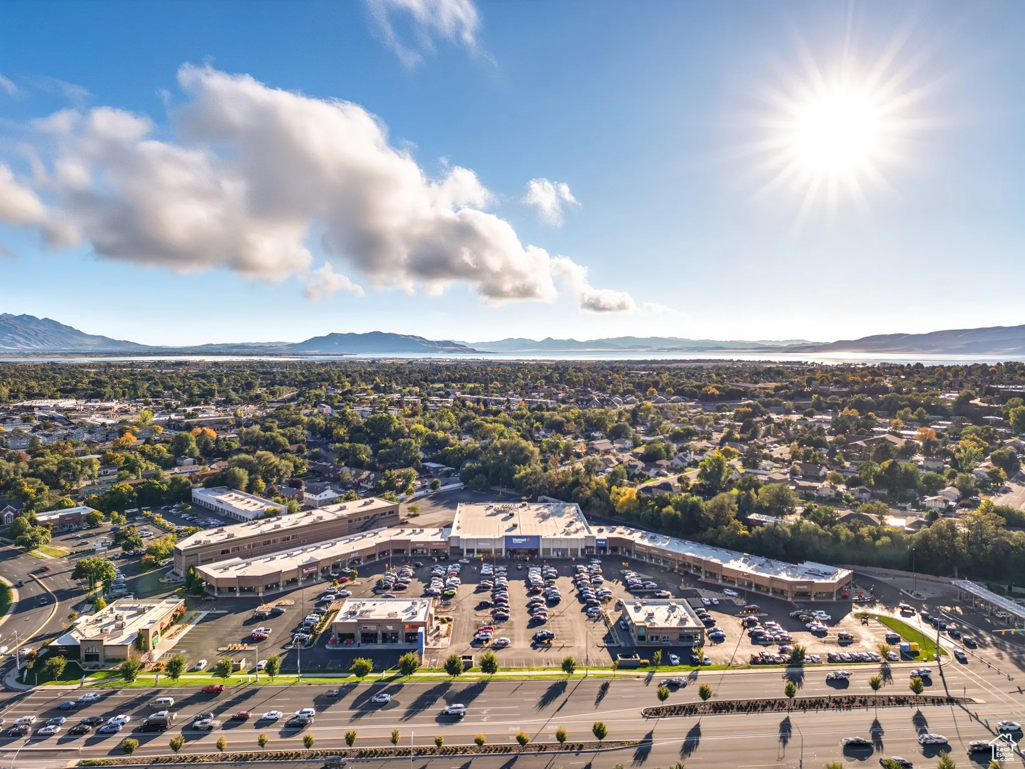 Aerial overview of property's location featuring a mountainous background