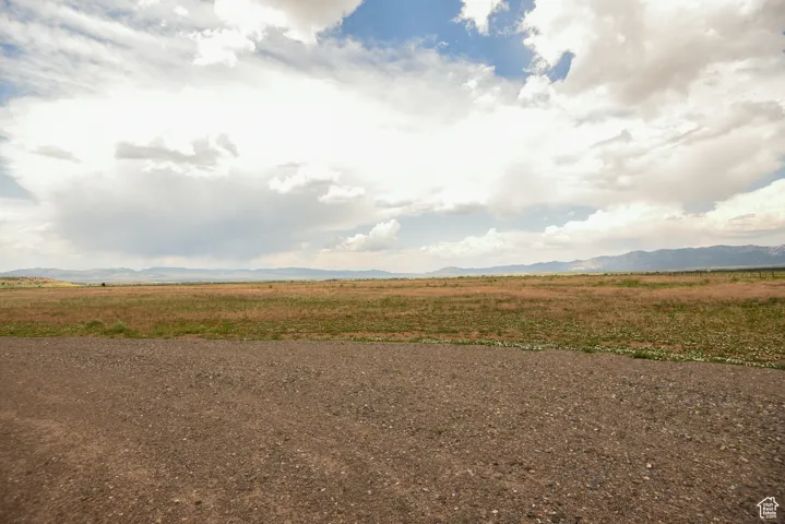 View of yard with a mountain view and a view of countryside