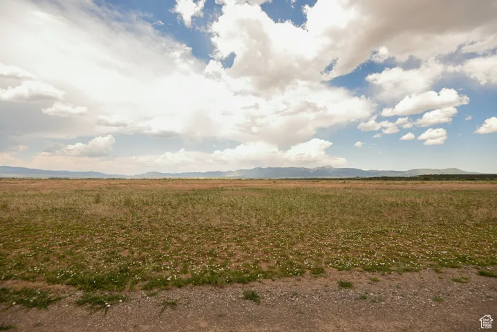 View of mountain background featuring rural landscape
