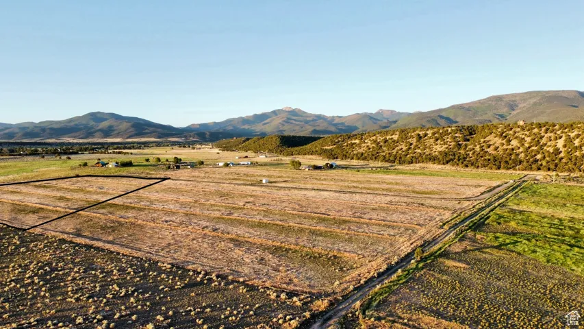 View of mountain backdrop with rural landscape