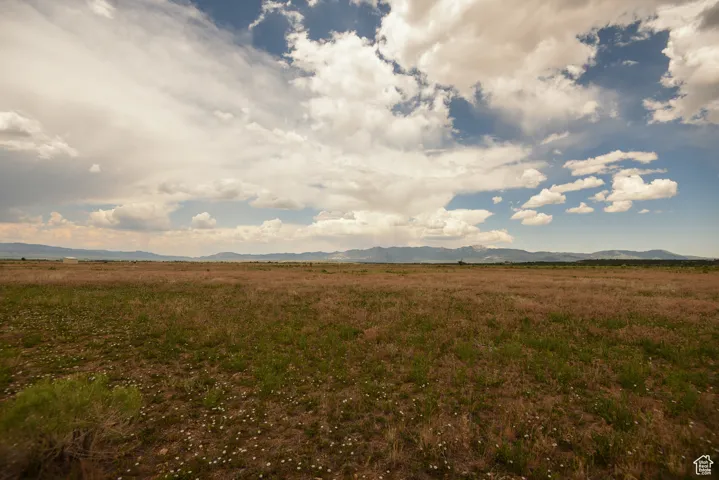View of mountain background featuring rural landscape