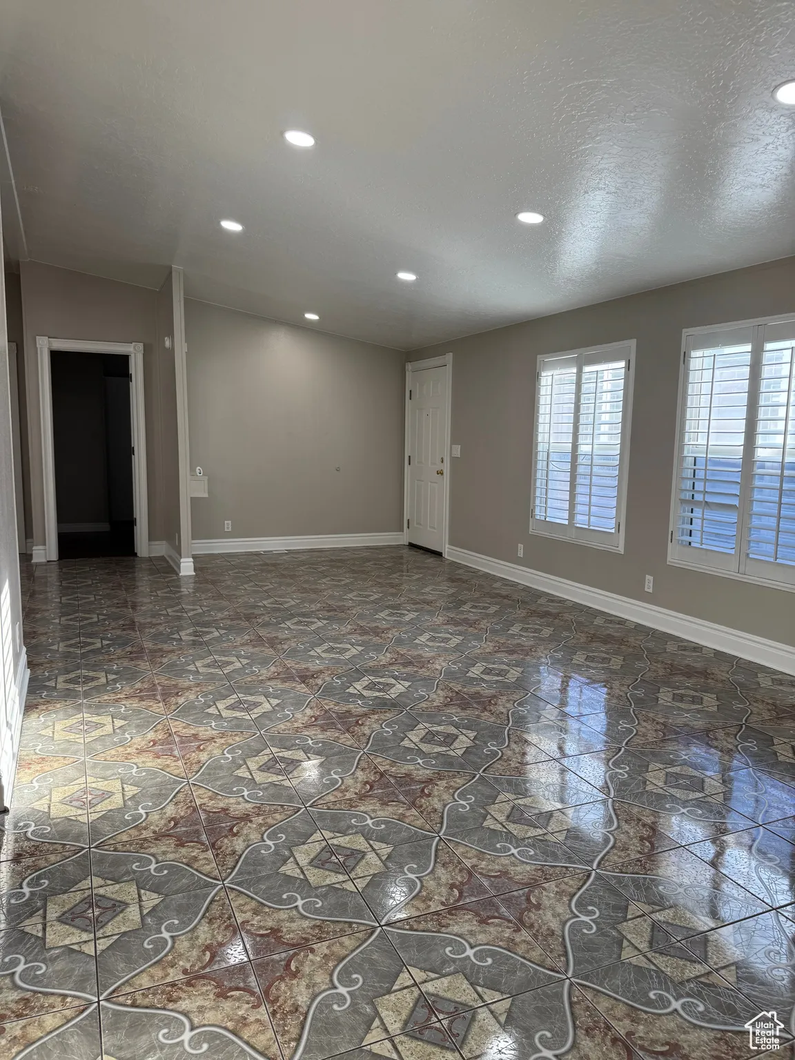 Empty room featuring recessed lighting and a textured ceiling