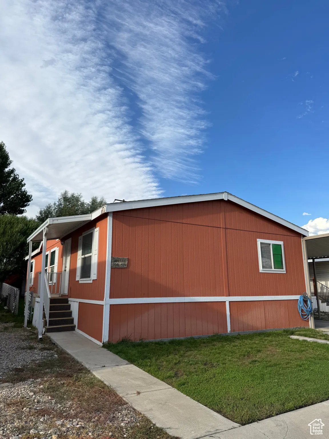 View of home's exterior with a yard