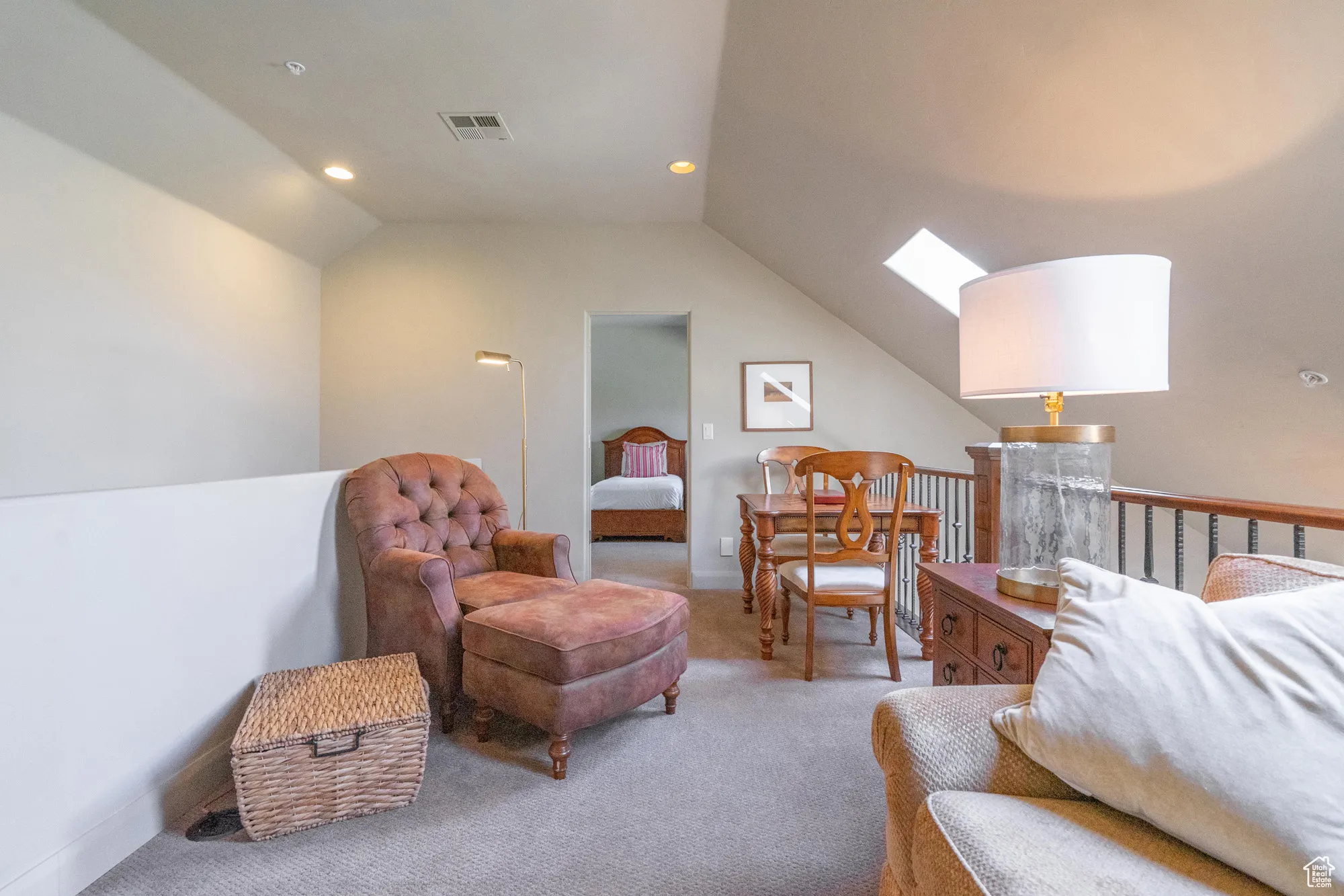 Sitting room featuring a skylight, carpet, lofted ceiling, and recessed lighting