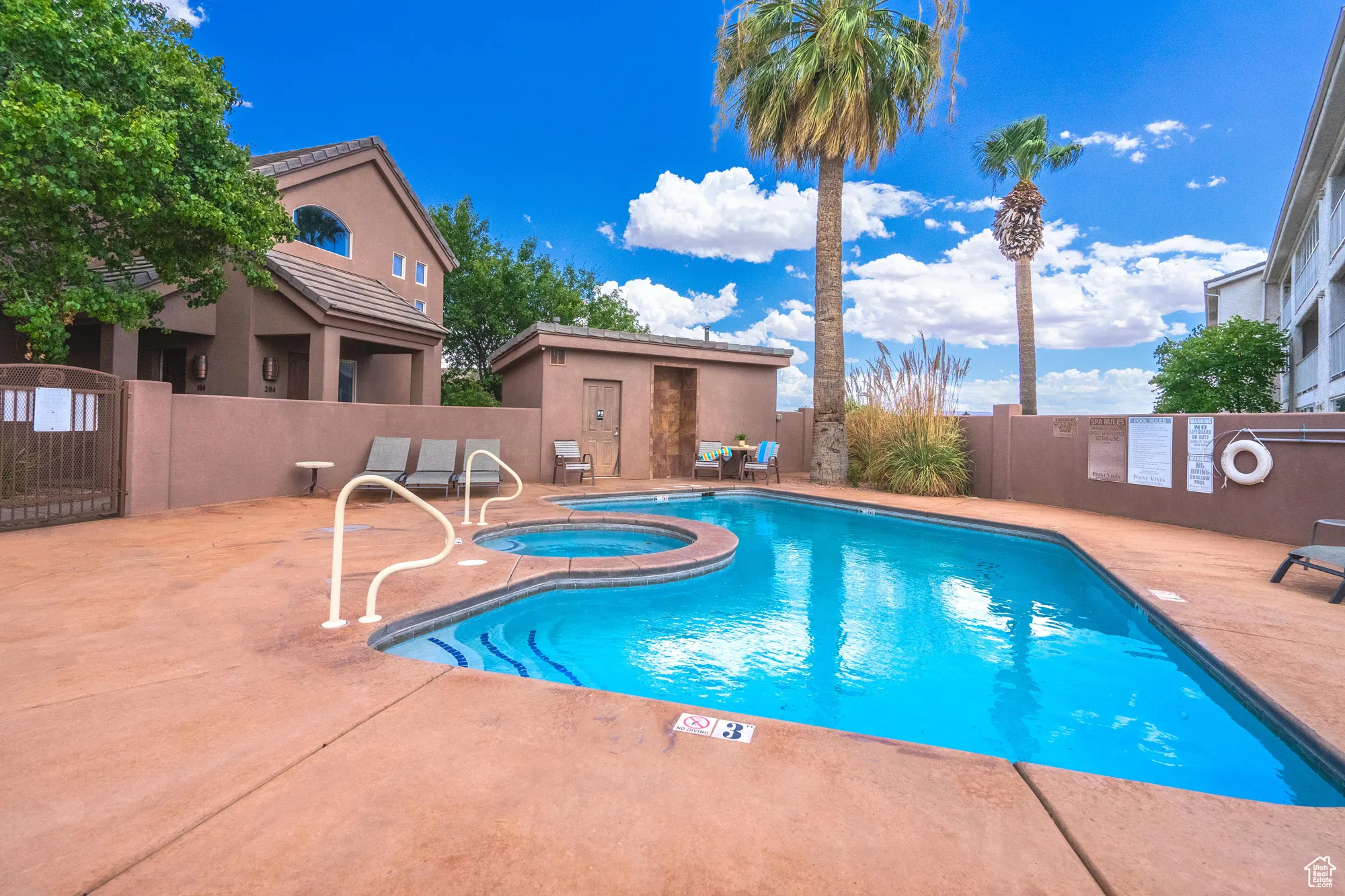 Community pool featuring a patio and a community hot tub