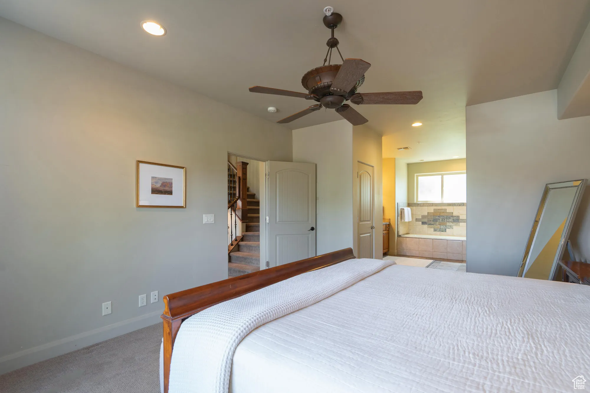 Bedroom featuring recessed lighting, light carpet, and a ceiling fan