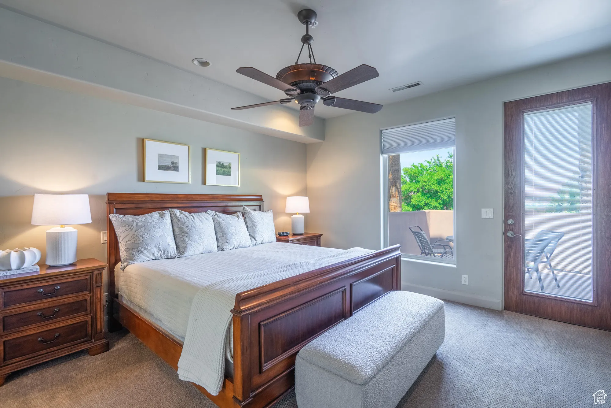 Carpeted bedroom with access to outside and a ceiling fan