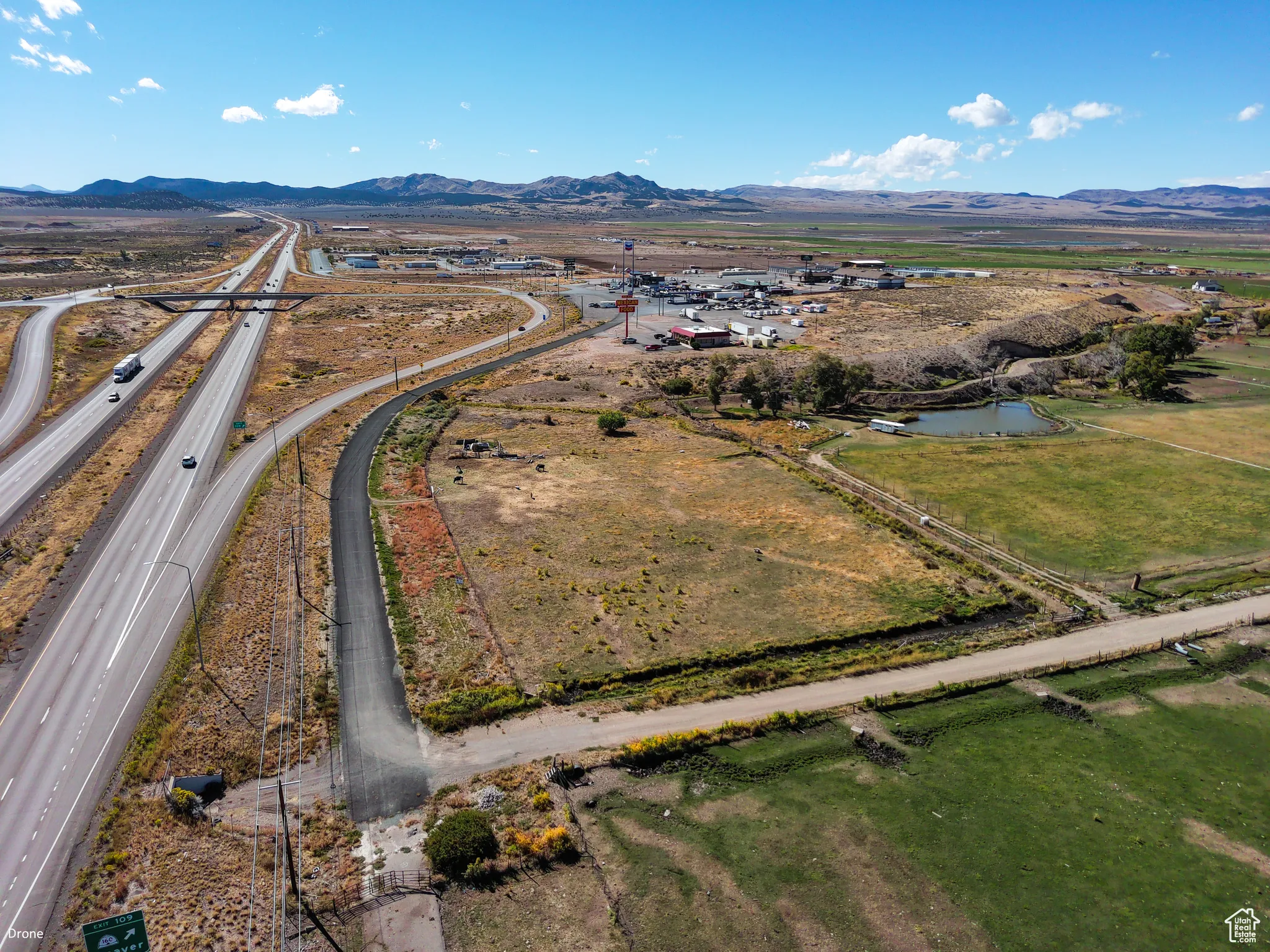 View of property location with a mountain backdrop and rural landscape