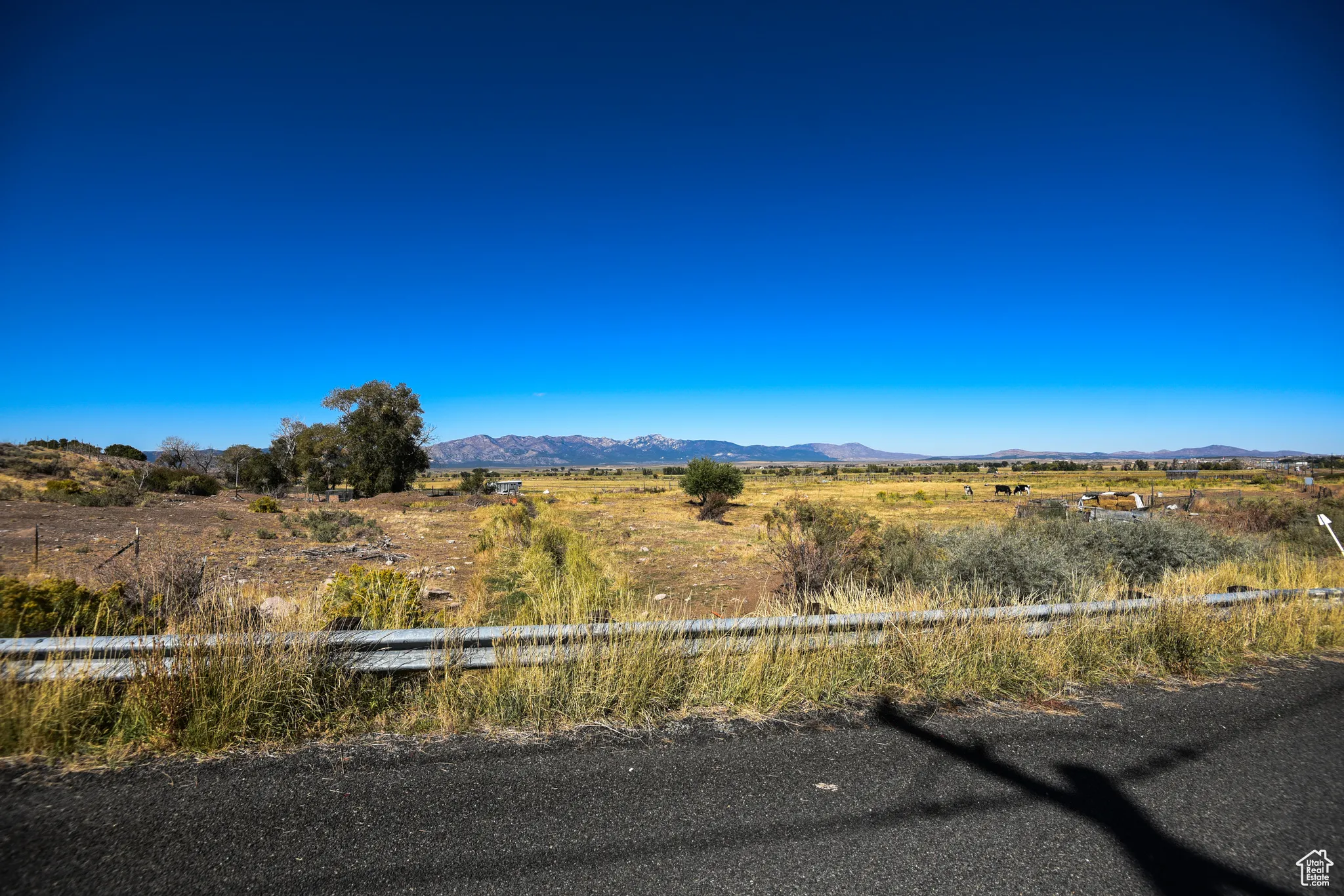 View of mountain backdrop with rural landscape