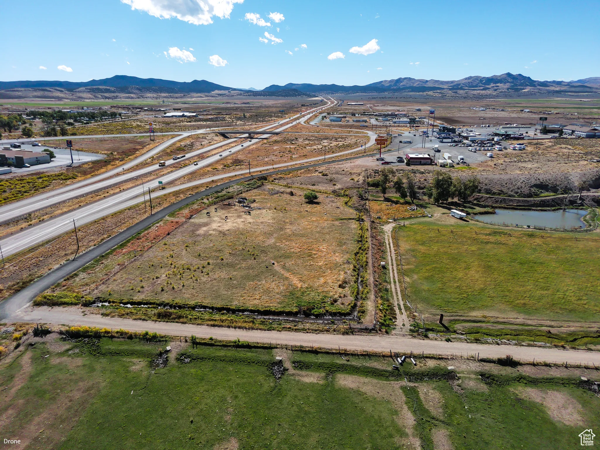 Aerial overview of property's location with a water and mountain view
