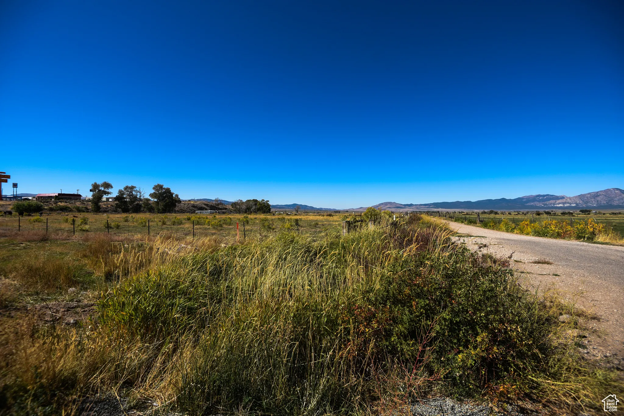 View of mountain backdrop with rural landscape