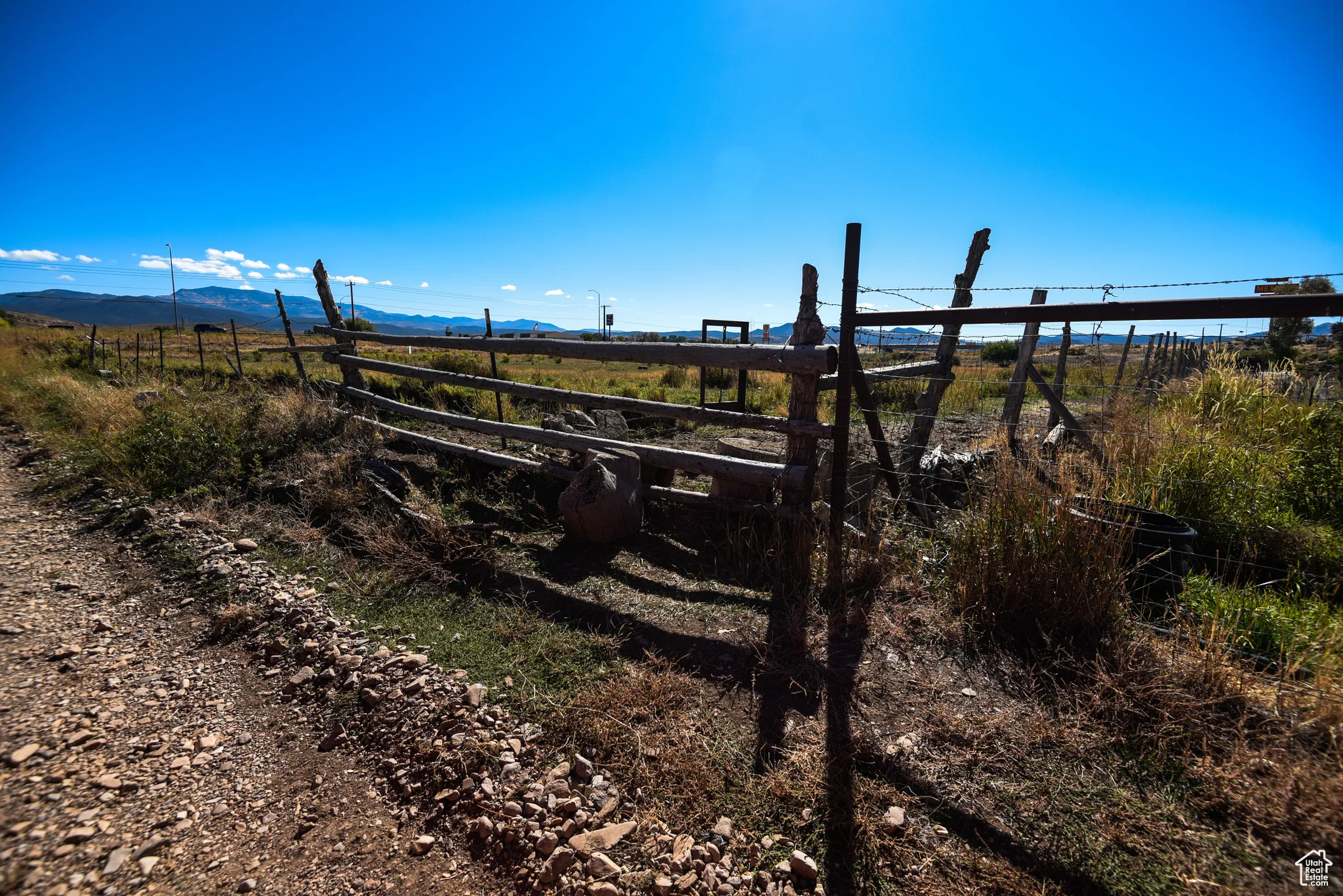 View of yard with a rural view and a mountain view