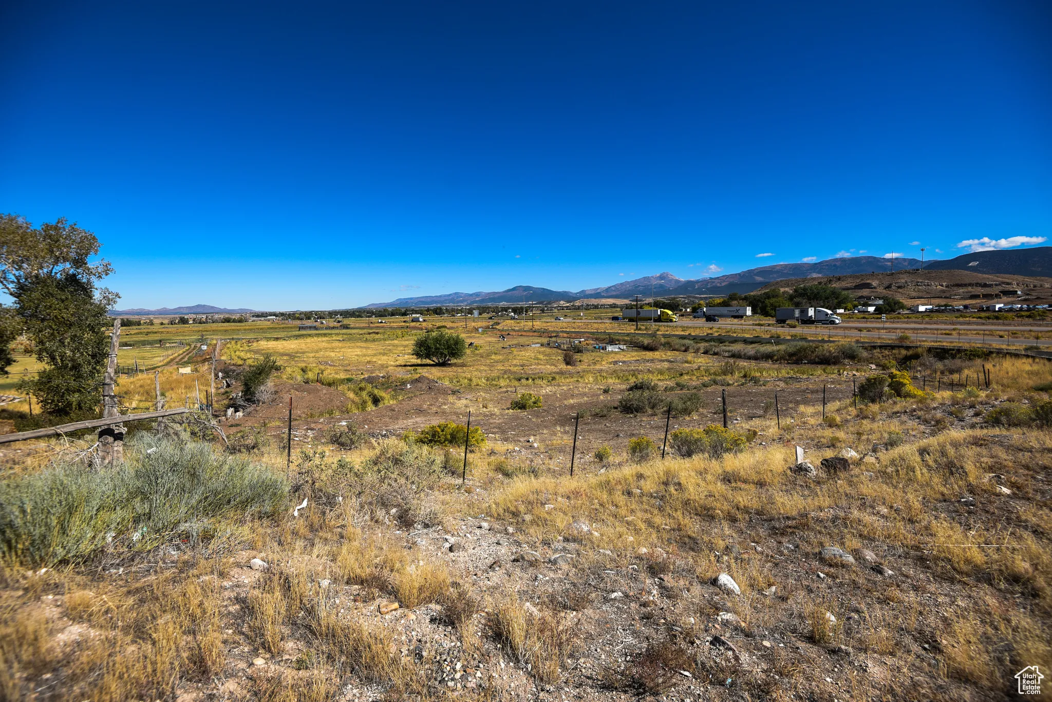 View of mountain backdrop with rural landscape