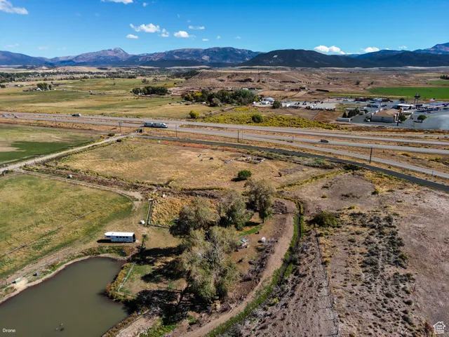 Overview of rural landscape featuring a water and mountain view