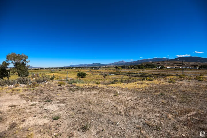 View of mountain background featuring rural landscape