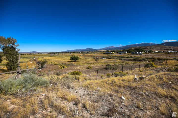 View of mountain backdrop with rural landscape