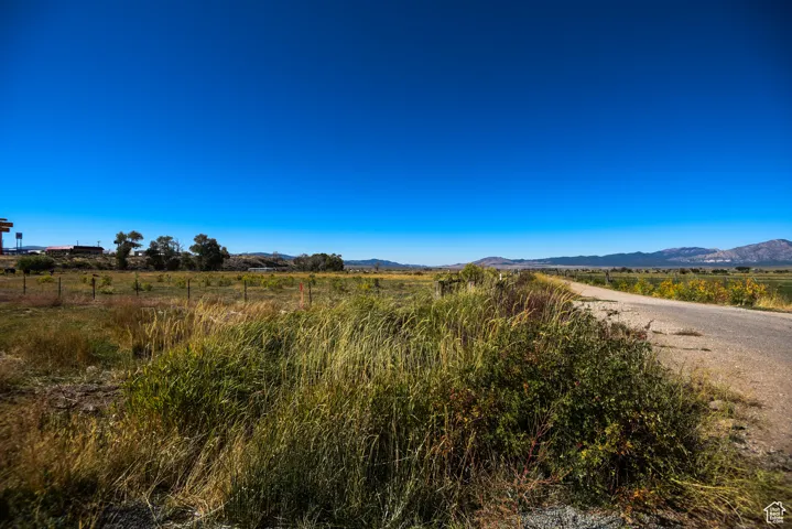 View of mountain backdrop with rural landscape