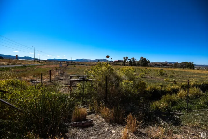 View of mountain background featuring rural landscape