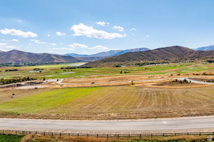 View of mountain backdrop featuring rural landscape