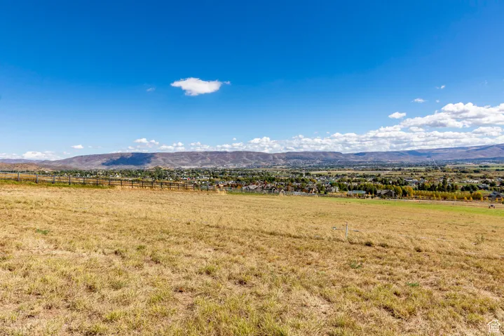View of mountain background featuring rural landscape