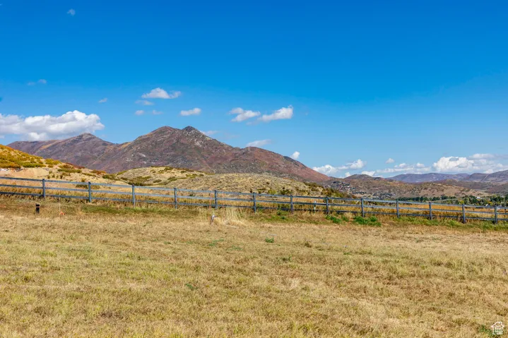 View of mountain backdrop featuring rural landscape