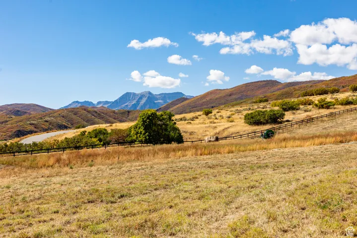View of mountain backdrop with rural landscape