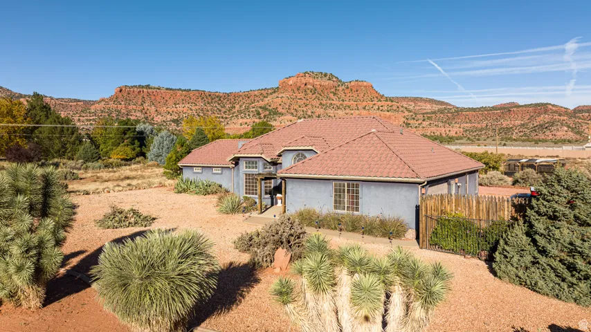 Spanish-style house with stucco siding and Rock Rock Views