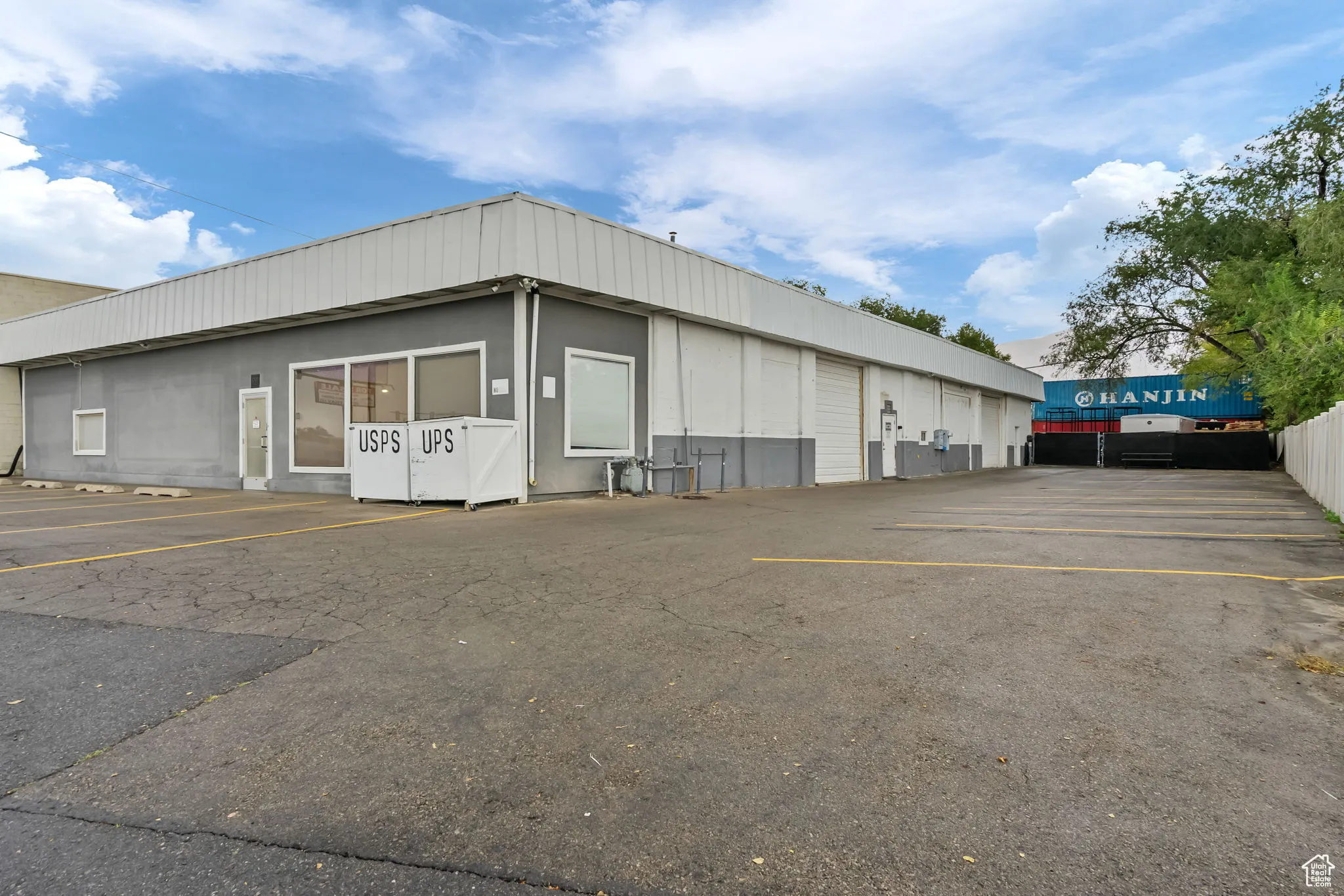 View of property with uncovered parking