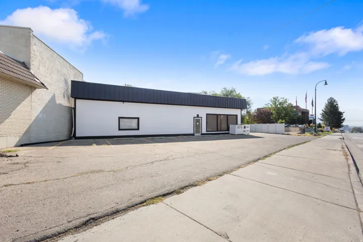 White exterior with dark roofline