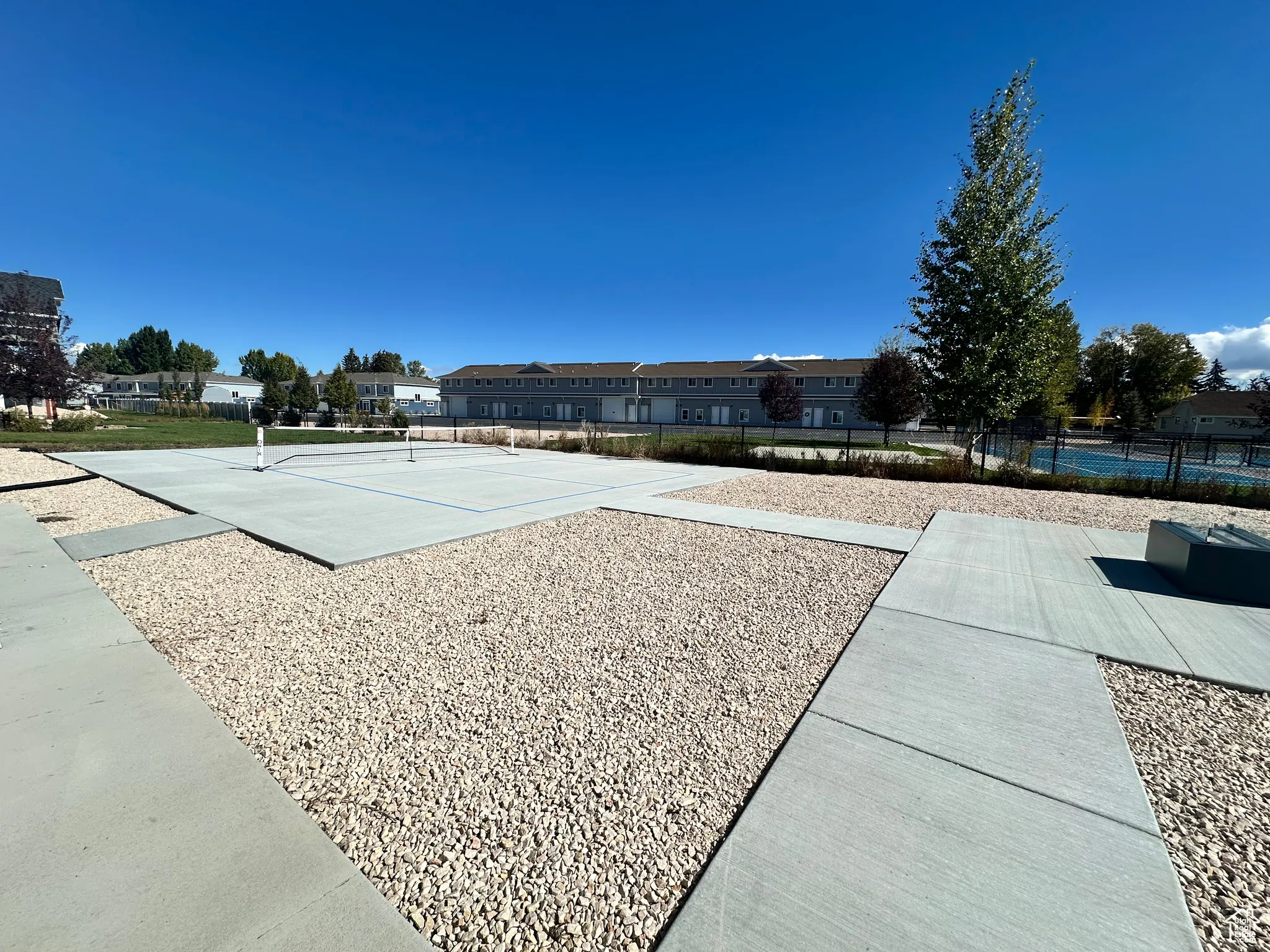View of community with a tennis court