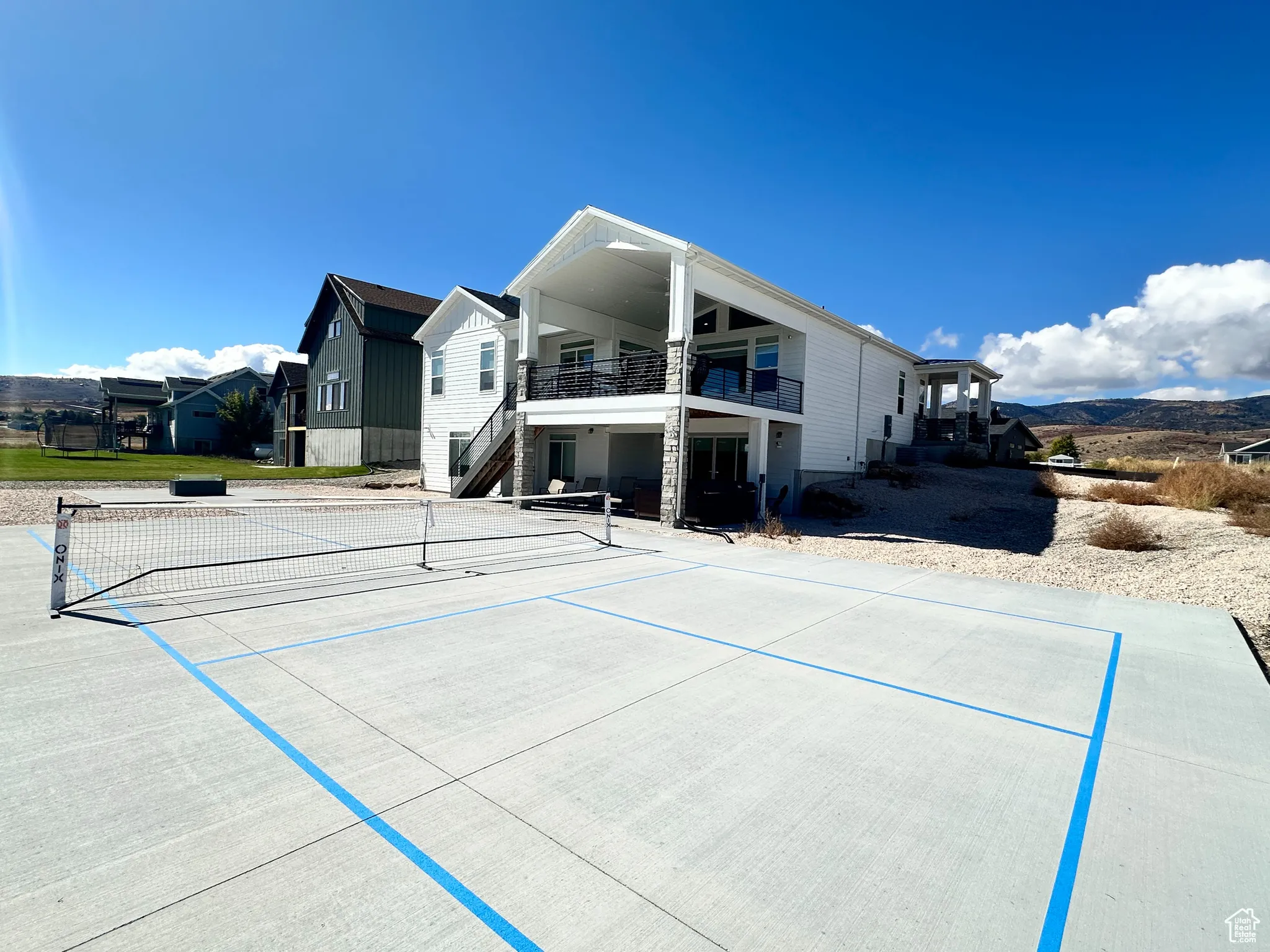 Back of house featuring stairs and a patio area