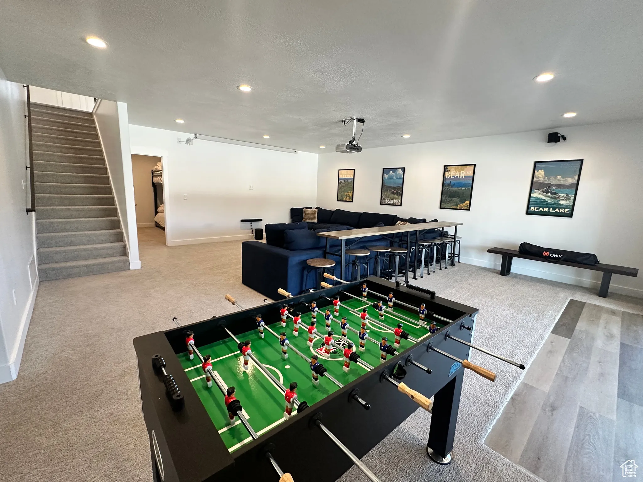 Game room with recessed lighting and a textured ceiling