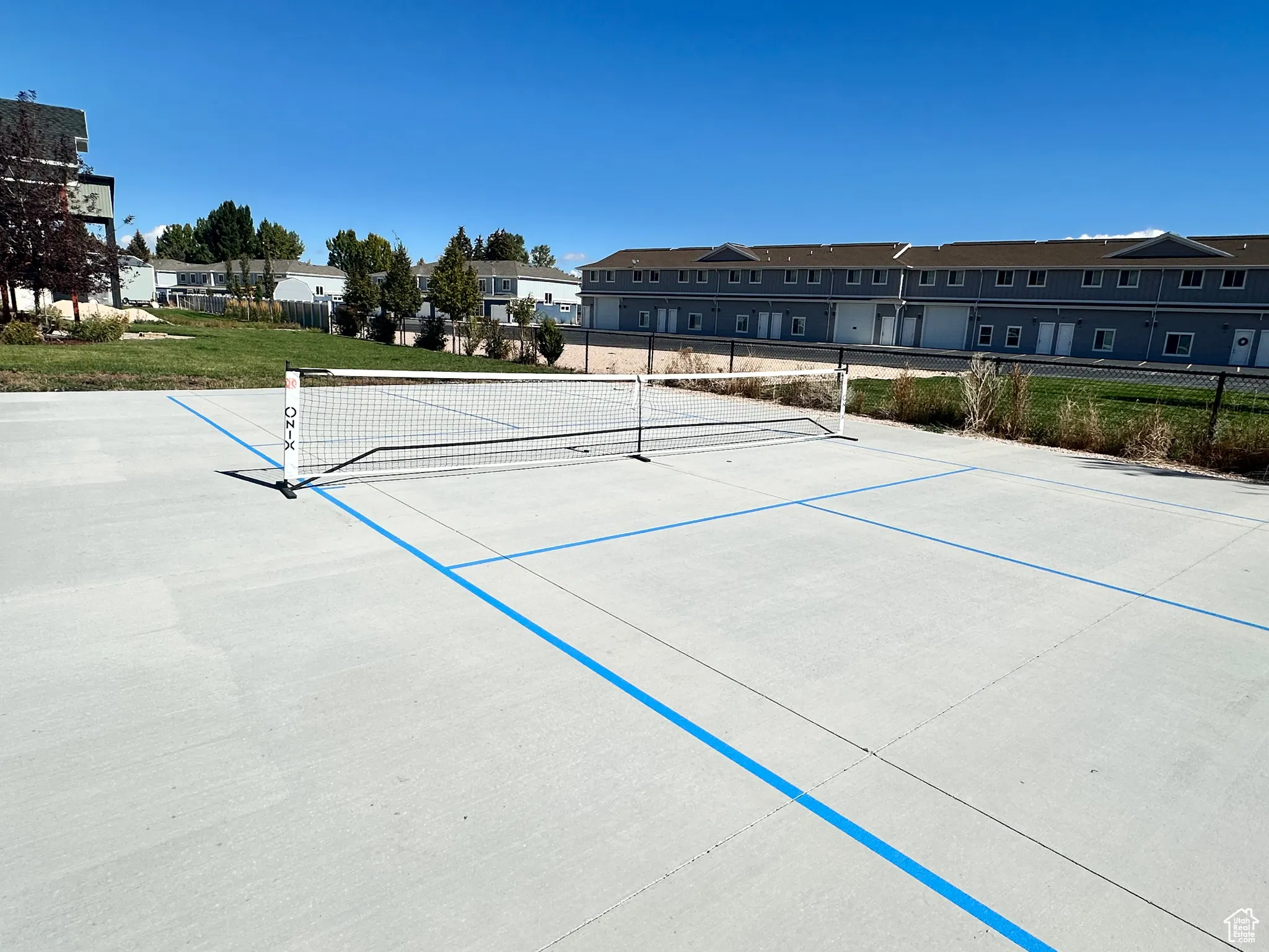 View of community with a residential view and a tennis court