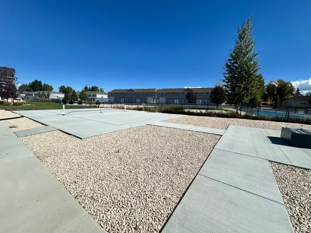 View of community with a tennis court