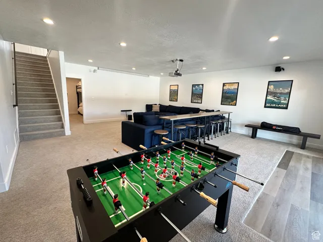 Game room with recessed lighting and a textured ceiling