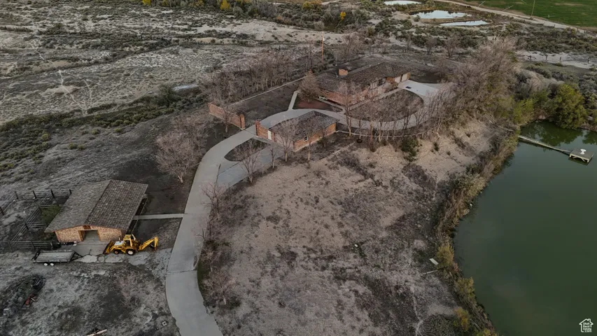 Aerial view of property's location featuring a large body of water