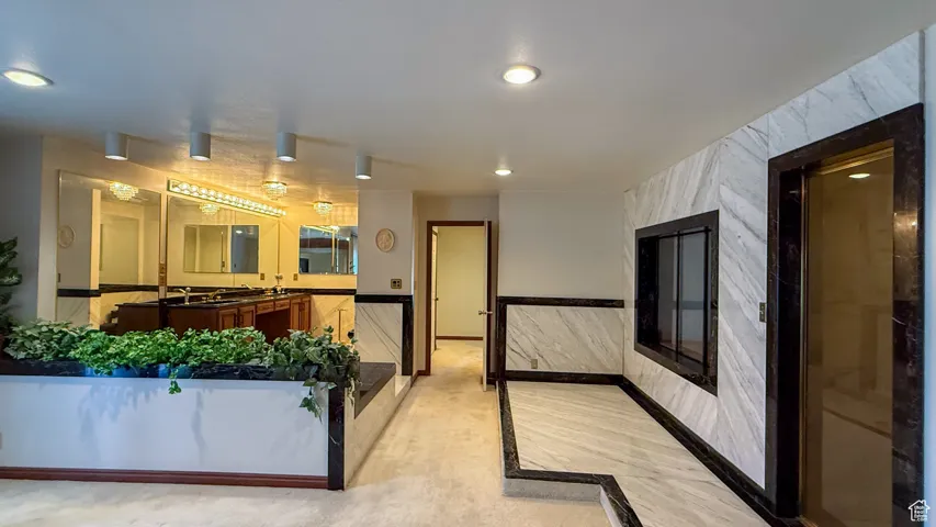 Reception area featuring wainscoting and recessed lighting