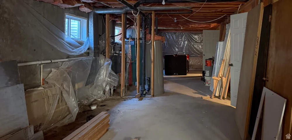 Below grade area featuring water heater
