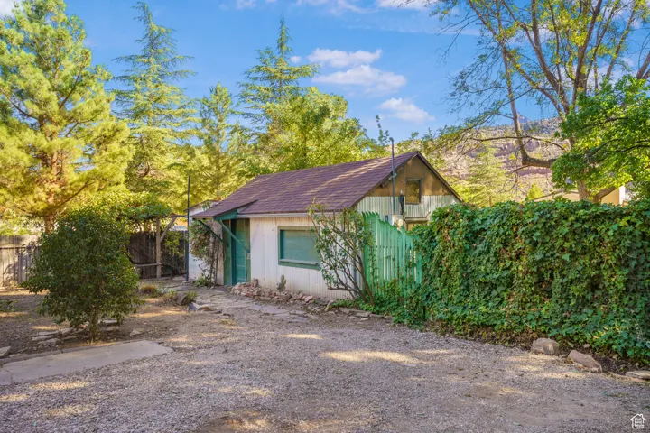 View of front of home featuring roof with shingles